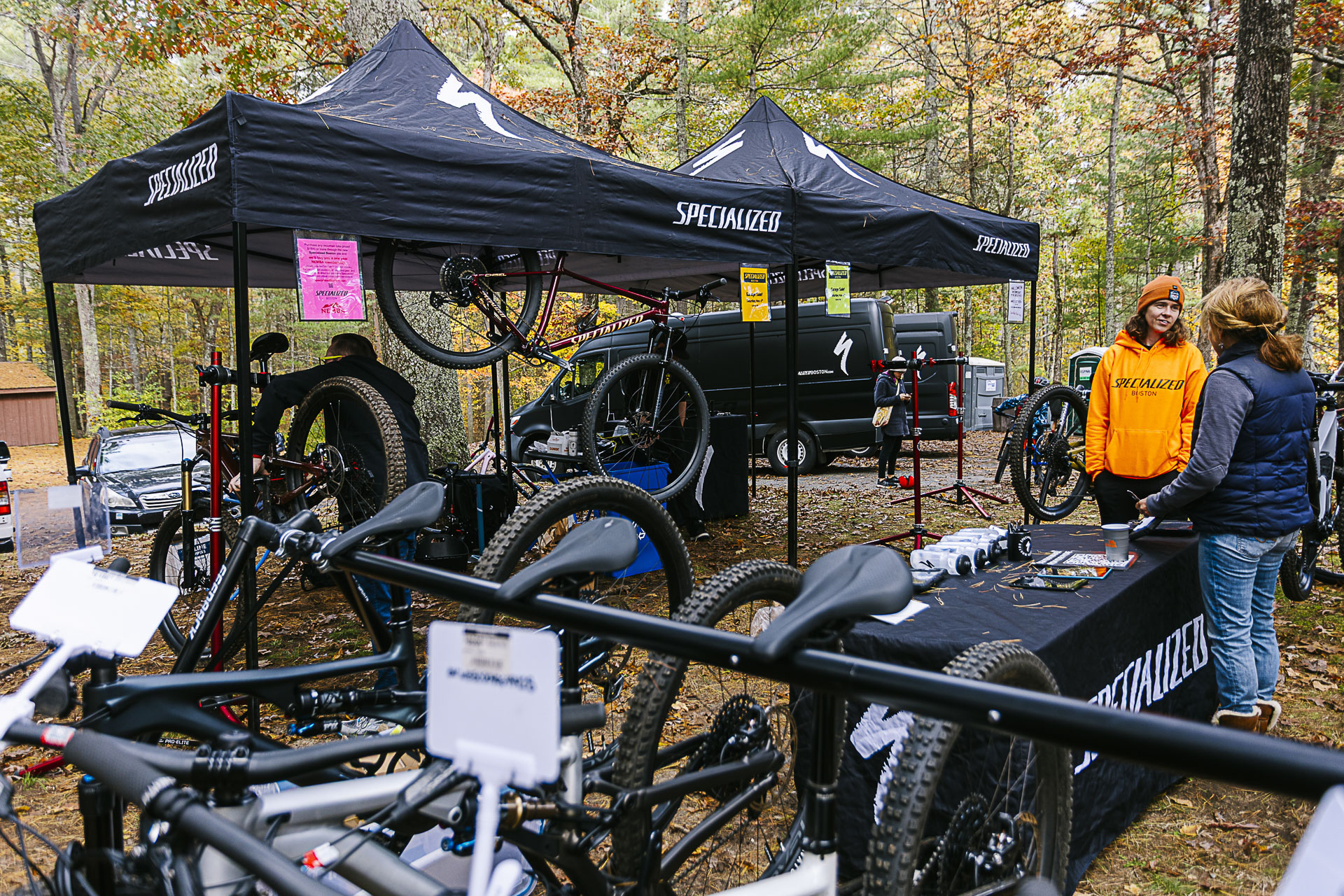 A demo tent with mountain bikes lined up for test rides