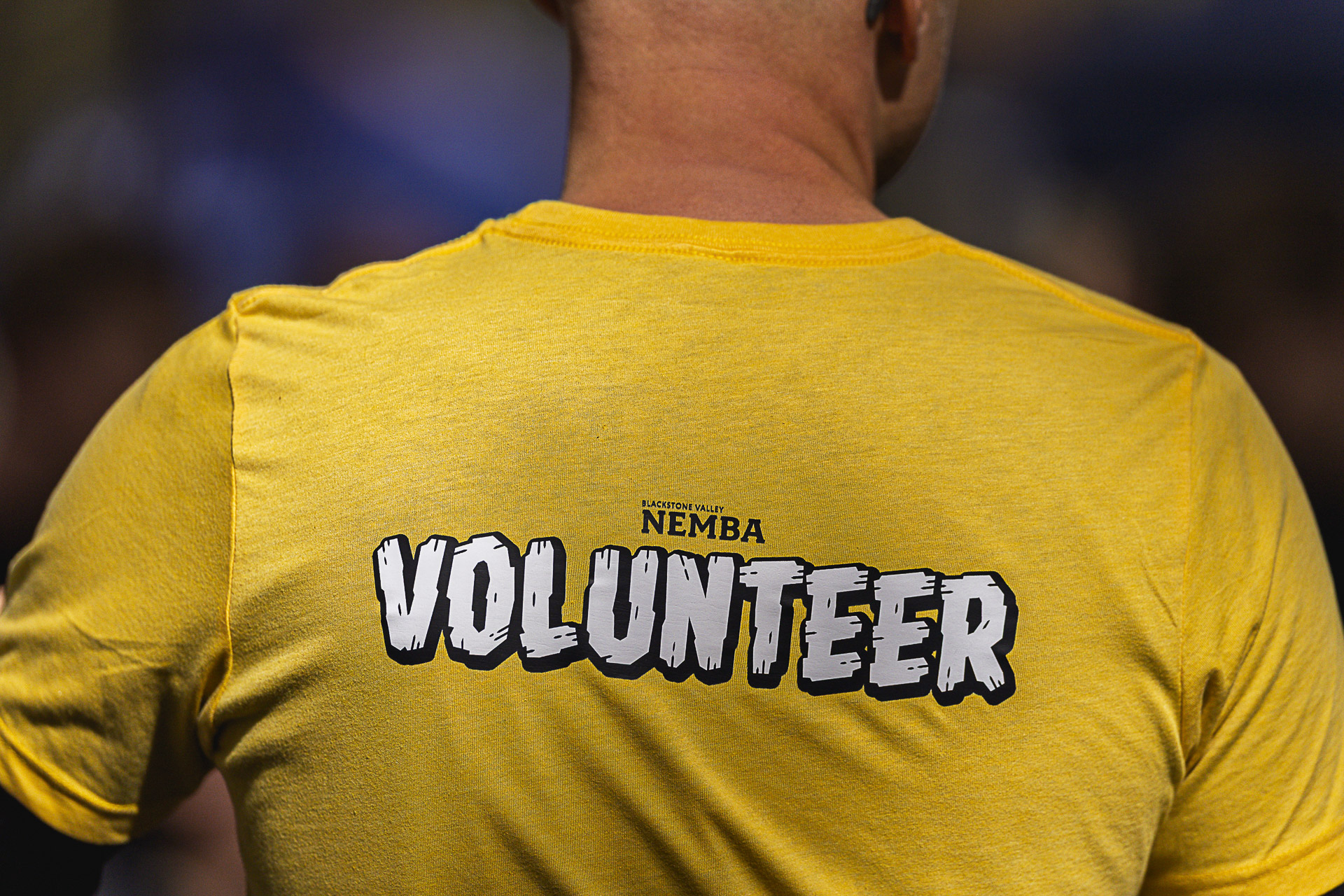 The back of a yellow Blackstone Valley NEMBA volunteer shirt